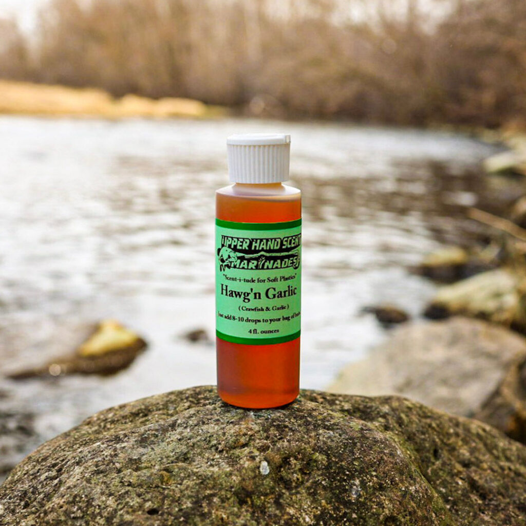 Bottle of Upper Hand Scents liquid fishing scent. Hawg 'n Garlic